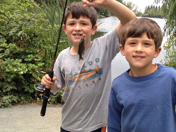 two kids fishing at Lake Temescal