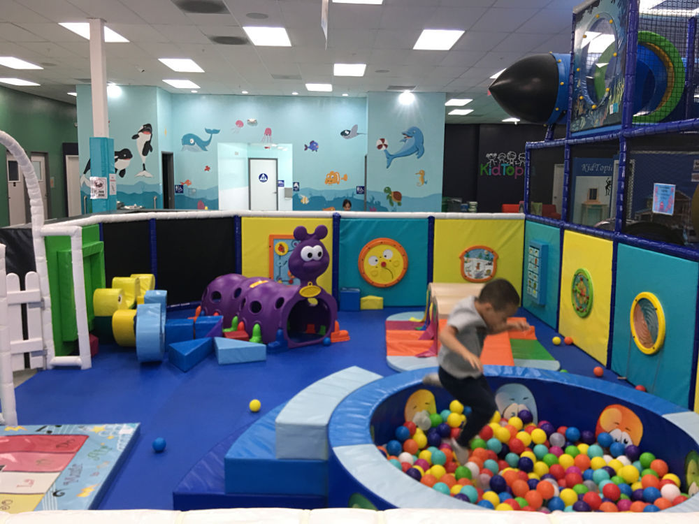 Jace jumping into ball pit in Crawler Zone