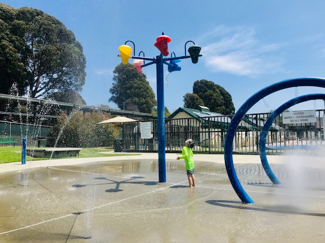 child playing in water park