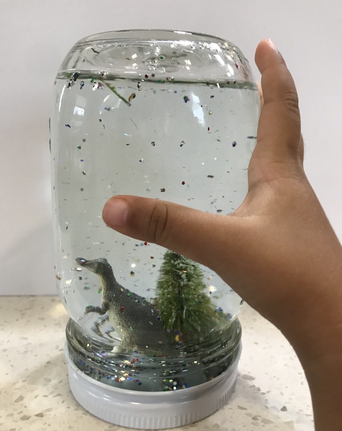 Homemade dino snow globe