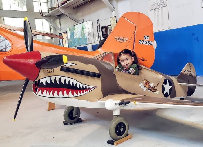 child in fighter plane