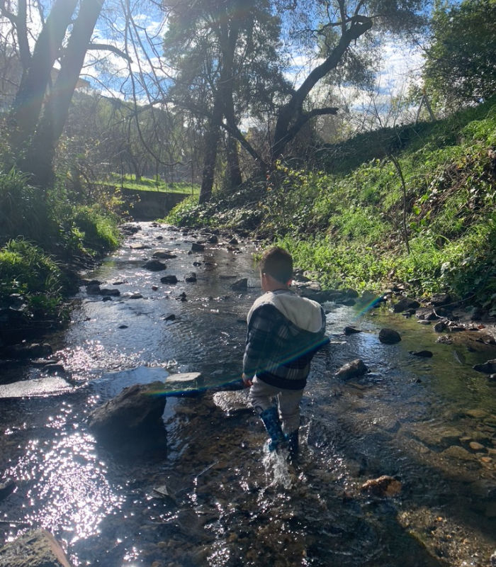 child stomping in sausal creek oakland