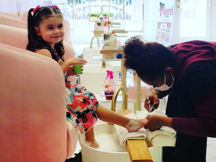 little girl at nail salon getting pedicure