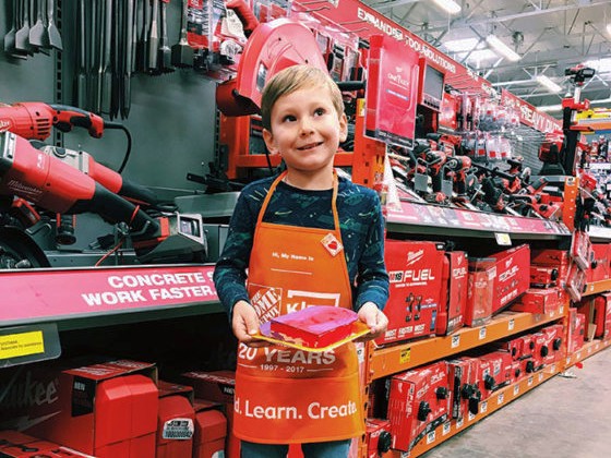 Kid at free kid's workshop at Home Depot