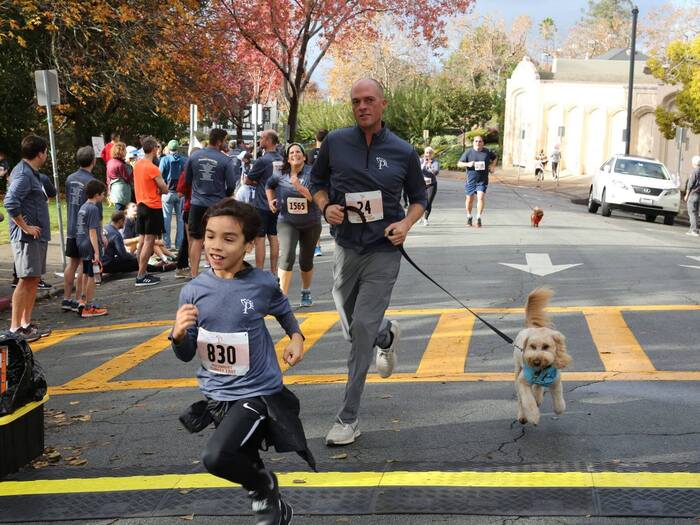 Family running in turkey trot road race