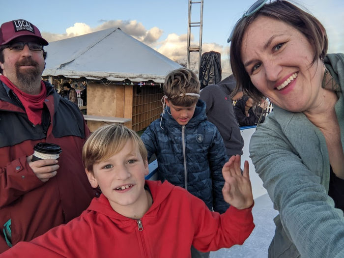 family on ice rink