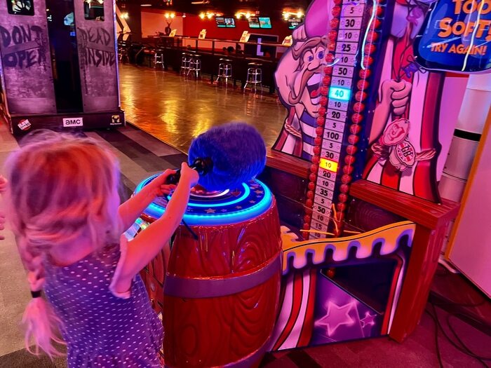 Child playing at arcade